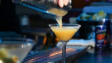Bartender Pouring Drink in Glass