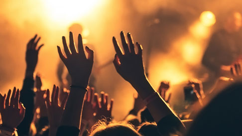 crowd with their hands up