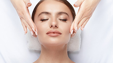 Woman at spa getting a face massage
