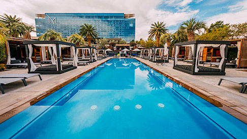 m pool with day beds and M Resort in the background