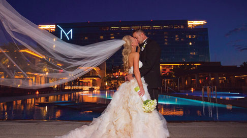 bride and groom outside of M Resort