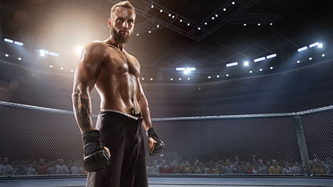 A UFC fighter stands in the ring