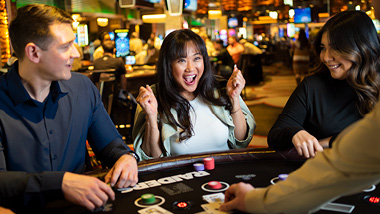 someone winning at a casino table 
